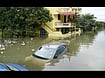 Heavy Rains Batter Pondy; Schools Shut, Low-Lying Areas Inundated Special Arrangement : A car submerged in floodwaters in front of inundated houses following heavy rains in Puducherry