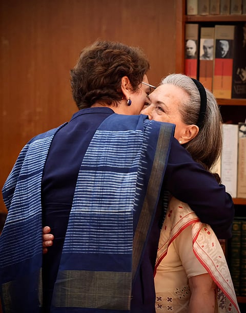 Congress Parliamentary Party Chairperson (CPP) and MP Sonia Gandhi being greeted by her daughter and MP Priyanka Gandhi Vadra during the unveiling of her upcoming book 'Belonging: A Journey of Love', as she makes her debut on Instagram, in New Delhi. 