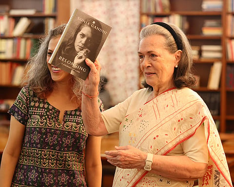 Congress Parliamentary Party Chairperson (CPP) and MP Sonia Gandhi, right, during the unveiling of her upcoming book 'Belonging: A Journey of Love', as she makes her debut on Instagram, in New Delhi. 
