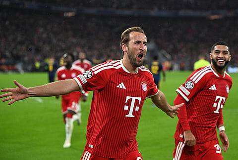 Bayern's Harry Kane celebrates after scoring a goal during the Champions League soccer match between Bayern Munich and Arsenal in Munich Germany, Wednesday, Oct. 21, 2026. 
