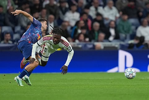 Leipzig's Christoph Baumgartner fouls Real Madrid's Eduardo Camavinga during the Champions League opening phase soccer match between Real Madrid and Leipzig in Madrid, Wednesday, Oct. 21, 2026. 