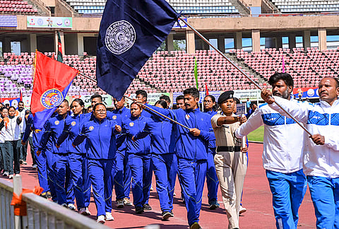 Police personnel march past during the inaugural ceremony of the 15th All India Police Archery Championship 2026, at Birsa Munda Athletics Stadium in Ranchi.