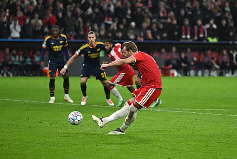 Bayern's Harry Kane scores a goal from a penalty during the Champions League soccer match between Bayern Munich and Arsenal in Munich Germany, Wednesday, Oct. 21, 2026. 