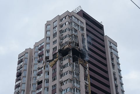 A multi-story residential building is seen damaged after a Russian drone strike on Kyiv, Ukraine, Wednesday, Oct. 21, 2026. 