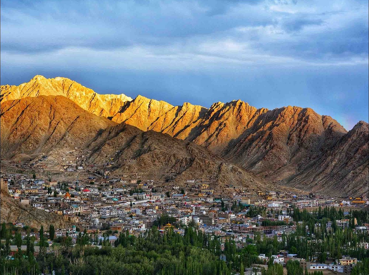 Panoramic view of Leh town nestled at the foot of mountain ranges in Ladakh. - Camps of Ladakh
