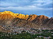 Camps of Ladakh : Panoramic view of Leh town nestled at the foot of mountain ranges in Ladakh.