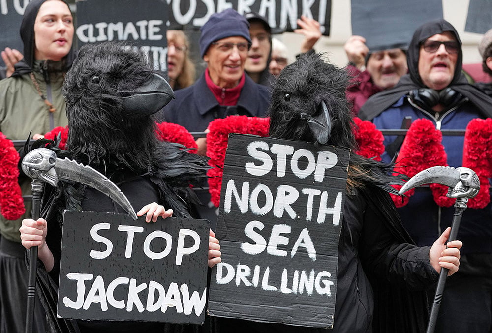 Activists protest against the government's approval of a natural gas project off Scotland's coast at the Department for Energy Security and Net Zero in London, Wednesday, Oct. 21, 2026. 
 - | Photo: AP/Kirsty Wigglesworth