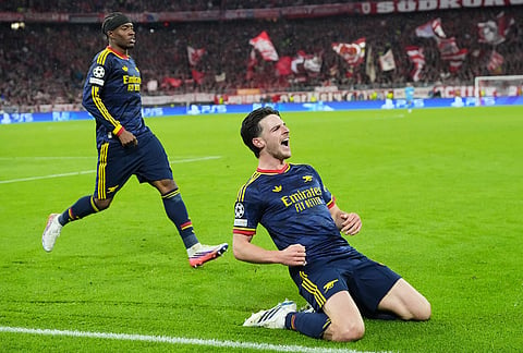 Arsenal's Declan Rice celebrates after scoring his side's second goal during the UEFA Champions League soccer match between Bayern Munich and Arsenal in Munich Germany, Wednesday, Oct. 21, 2026. 
