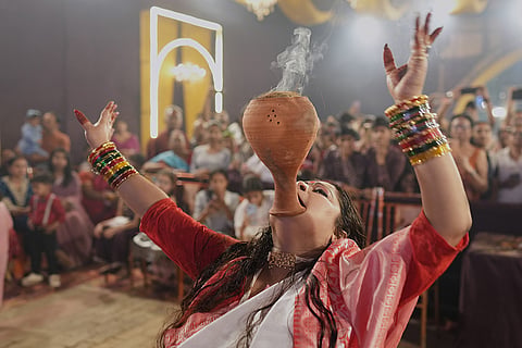A Hindu devotee performs a traditional Dhunuchi dance inside a temporary worship venue of goddess Durga during Durga Puja celebrations on the last day of Durga Puja festival in Prayagraj, in the northern Indian state of Uttar Pradesh, Tuesday, Oct. 20, 2026.