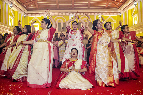 Women dressed in traditional attire perform Dhunuchi Naach at a community pandal during Durga Puja festival, at Vashi, in Navi Mumbai, Saturday, Oct. 17, 2026.