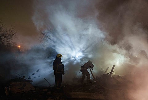 Rescue workers put out a fire at a residential house destroyed in a Russian missile strike on Kyiv, Ukraine, Wednesday, Oct. 21, 2026. 
