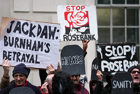 Activists protest against the government's approval of a natural gas project off Scotland's coast at the Department for Energy Security and Net Zero in London, Wednesday, Oct. 21, 2026. 
