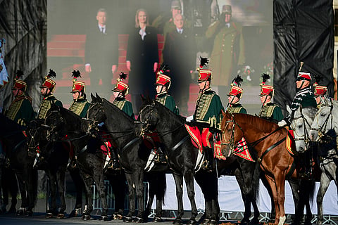 Honor guards attend a flag-raising ceremony marking the 70th anniversary of the 1956 Hungarian Revolution against Soviet-backed communist rule in Budapest, Hungary, Friday, Oct. 23, 2026.