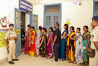 | Photo: PTI  : Voters wait in a queue at a polling station as they arrive to cast their vote for the Graduate and Patna Teacher constituencies of the Bihar Legislative Council (MLC), in Patna.