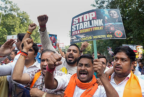 Swadeshi Jagran Manch (SJM) members hold placards during a protest march against Starlink, the satellite-based internet service owned by industrialist Elon Musk, in New Delhi, Friday, Oct. 23, 2026. 
