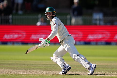 Australia's Alex Carey watches on his shot on day five of the second cricket test match between South Africa and Australia, in Gqeberha, South Africa, Thursday, Oct. 22, 2026.
