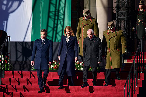 From left, Hungarian Prime Minister Peter Magyar, Agnes Forsthoffer, the Speaker of the National Assembly of Hungary and Hungary's President Andras Baka attend a flag-raising ceremony marking the 70th anniversary of the 1956 Hungarian Revolution against Soviet-backed communist rule in Budapest, Hungary, Friday, Oct. 23, 2026.