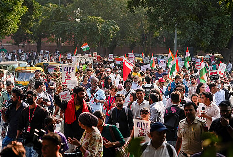 Activists during a protest demanding the resignation of Chief Election Commissioner Gyanesh Kumar over the Special Intensive Revision (SIR) of electoral rolls, in New Delhi, Friday, Oct. 23, 2026. 
