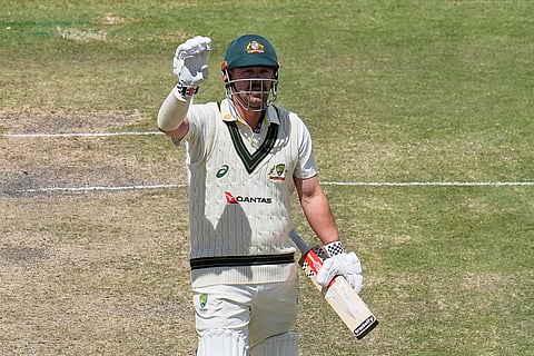 Australia's Travis Head celebrates his hundred on day five of the second cricket test match between South Africa and Australia, in Gqeberha, South Africa, Thursday, Oct. 22, 2026.