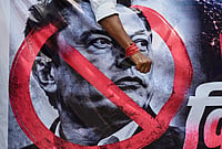 In Photos: Swadeshi Jagran Manch Protests Against Starlink In Delhi | Photo: AP/Vipin : A banner with a portrait of Elon Musk is carried by members of Swadeshi Jagaran Manch, an organization affiliated to Hindu nationalist Rashtriya Swayamsevak Sangh (RSS), as they stage a protest against Elon Musk's Starlink, in New Delhi.