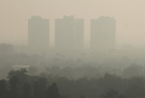 High-rise buildings remain shrouded amid hazy conditions, in Gurugram, Monday, Oct. 19, 2026. 