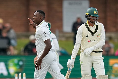 South Africa's Kagiso Rabada, left, celebrates the wicket of Australia's Mitchell Starc, right, on day five of the second cricket test match between South Africa and Australia, in Gqeberha, South Africa, Thursday, Oct. 22, 2026.
