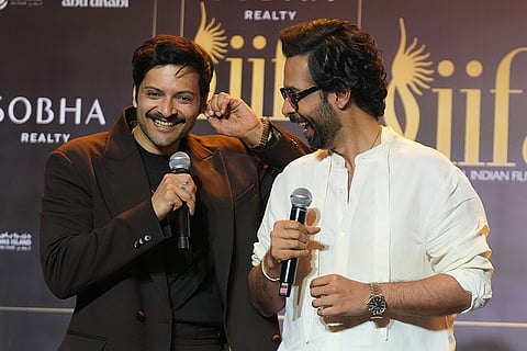 Bollywood actors Ali Fazal, left, and Abhishek Banerjee share a light moment during a press conference to announce the dates and venue for the 2027 International Indian Film Academy (IIFA) Awards in Mumbai, India, Thursday, Oct. 22, 2026.