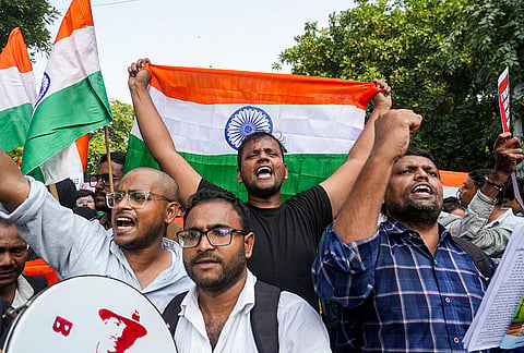 People stage a protest against the alleged deletion of voters and Special Intensive Revision (SIR) electoral rolls, in New Delhi, Friday, Oct. 23, 2026.
