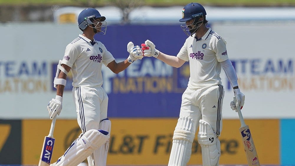 India's Yashasvi Jaiswal, left, and KL Rahul celebrate after scoring runs during the day one of the first cricket test match between Sri Lanka and India in Galle, Sri Lanka, Saturday, Aug. 15, 2026. 
 - | Photo: AP/Eranga Jayawardena