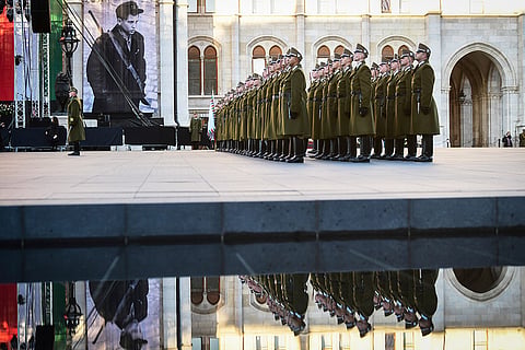 Honor guards stand at attention during a flag-raising ceremony marking the 70th anniversary of the 1956 Hungarian Revolution against Soviet-backed communist rule in Budapest, Hungary, Friday, Oct. 23, 2026.