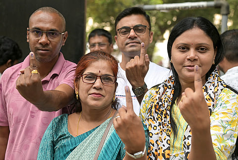 Voters show their ink-marked fingers after casting their votes for the five Teachers’ and Graduates’ seats of the Maharashtra Legislative Council, in Nagpur, Maharashtra.
