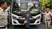 PTI/Karma Bhutia : A woman stands in front of a bus carrying detained demonstrators during a protest against the alleged deletion of voters and Special Intensive Revision (SIR) electoral rolls