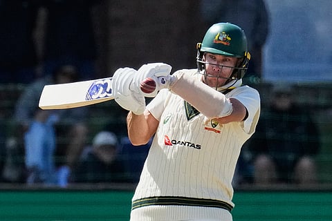Australia's Scott Boland plays a shot on day five of the second cricket test match between South Africa and Australia, in Gqeberha, South Africa, Thursday, Oct. 22, 2026.