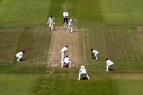 South Africa's Simon Harmer, center top, bowls during day five of the second cricket test match between South Africa and Australia in Gqeberha, South Africa, Thursday, Oct. 22, 2026.