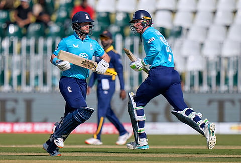 England's Tom Banton, right, and Ben Duckett run between the wickets during the tri-series one-day international cricket match between Sri Lanka and England, in Rawalpindi, Pakistan, Thursday, Oct. 22, 2026. 