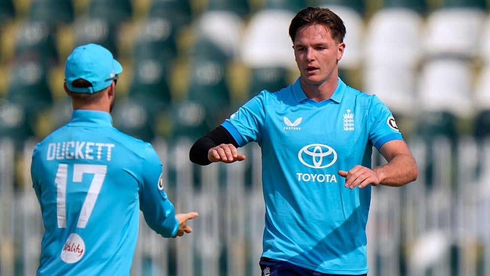 England's Sonny Baker, right, celebrates with teammate after taking the wicket of Pakistan's Saim Ayub during the tri-series one-day international cricket match between Pakistan and England, in Rawalpindi, Pakistan, Tuesday, Oct. 20, 2026. 
 - | Photo: AP/Anjum Naveed