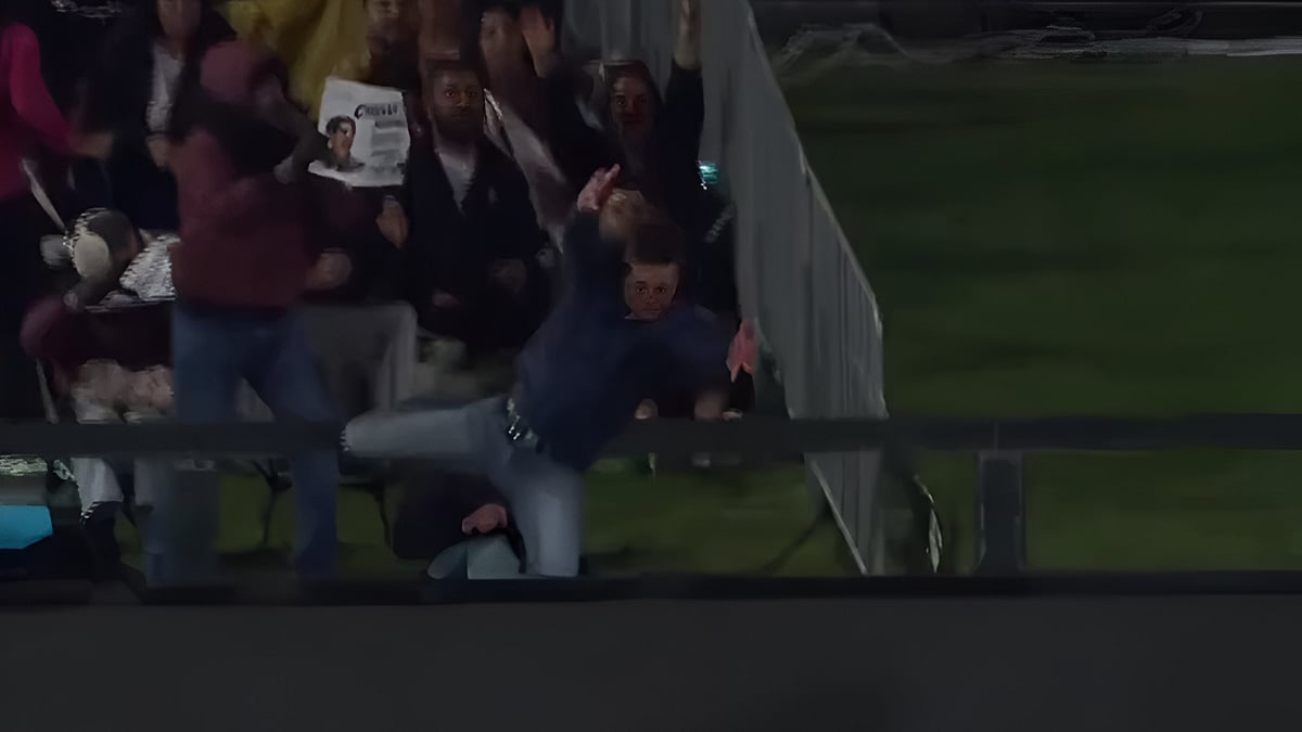 A spectator in Christchurch took a headfirst tumble over the boundary railing while attempting to take a crowd catch off Glenn Phillips' six - | Photo: SonyLIV (Screengrab)