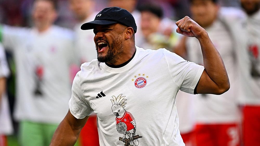 Bayern's coach Vincent Kompany celebrates after winning the German championship at the end of the Bundesliga soccer match between Bayern and Stuttgart in Munich, Germany. - | Photo: Tom Weller/dpa via AP