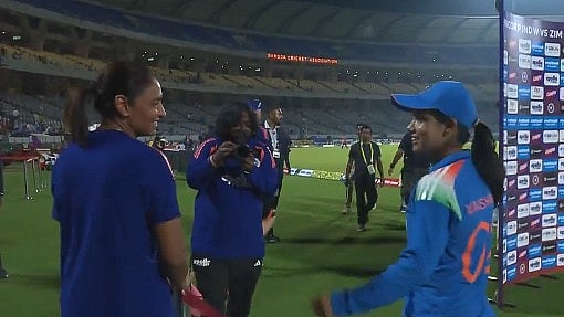 Vaishnavi and Harmanpreet showcased their trademark post-wicket routine—a handshake, fist bump, flying hand gesture, and hug. - bcciwomen/X