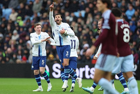 Manchester City's Ruben Dias celebrates after Manchester City's Erling Haaland scored during the English Premier League soccer match between Aston Villa and Manchester City in Birmingham, England, Saturday, Oct. 24, 2026. 
