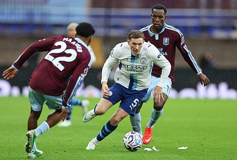 Manchester City's Elliot Anderson, centre, challenges for the ball with Aston Villa's Nicolas Jackson, right, and Aston Villa's Ian Maatsen during the English Premier League soccer match between Aston Villa and Manchester City in Birmingham, England, Saturday, Oct. 24, 2026. 