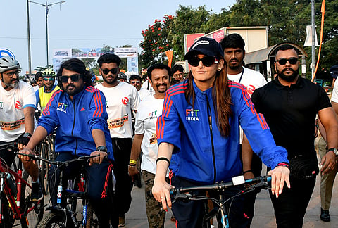 Actor Ragini Dwivedi during the 'Sundays on Cycle' 5-km cyclothon and walkathon under the 'Fit Karnataka for Fit India' initiative at Tolankere Circle, in Hubballi, Karnataka.