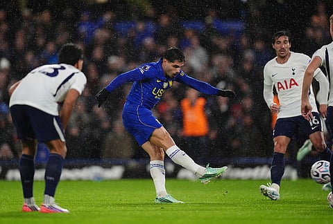 Chelsea's Pedro Neto, centre, hit a shot during the English Premier League soccer match between Chelsea and Tottenham Hotspur in London, Saturday, Oct. 24, 2026.  