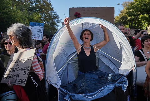People march during a protest to demand affordable housing in Lisbon, Portugal, Saturday, Oct. 24, 2026. 
