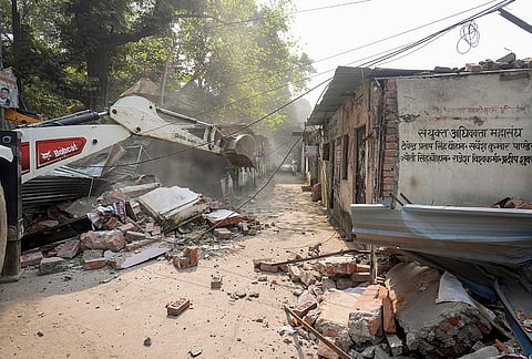 Municipal Corporation carry out a demolition drive of lawyers' chambers allegedly built illegally, following a High Court order, in Lucknow, Sunday, Oct. 25, 2026. 
