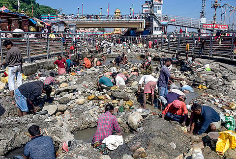 Volunteers take part in a cleanliness drive in the Ganga river, in Haridwar, Wednesday, Oct. 21, 2026. 

