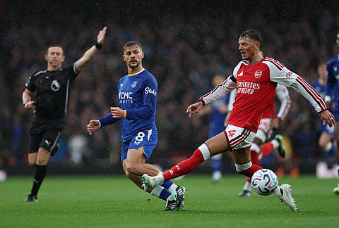 Everton's Kiernan Dewsbury-Hall passes the ball by Arsenal's Ben White during the English Premier League soccer match between Arsenal and Everton in London, Saturday, Oct. 24, 2026. 
