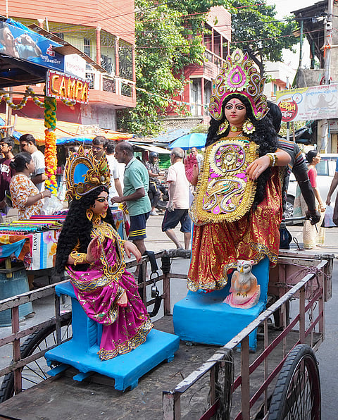 Idols of Goddess Lakshmi being transported to a worship venue on the eve of the 'Kojagari Lakshmi Puja', in Kolkata, West Bengal, Saturday, Oct. 24, 2026. 