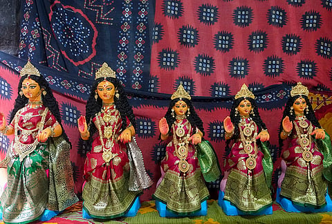 Idols of Goddess Lakshmi lined up at a store ahead of Lakshmi Puja, in Kolkata, Friday, Oct. 23, 2026. 
