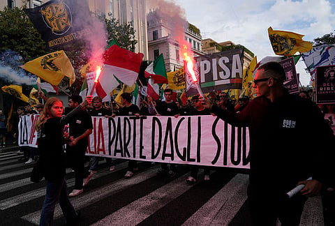 Members of right-wing student groups march through the streets of Rome, Saturday, Oct. 24, 2026, during a demonstration called "Unlock Everything," organized in opposition to recent left-wing student protests and one of several demonstrations held by groups across the political spectrum. 
